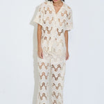 Model wearing the Cora ivory lace wide-leg pants with elasticated drawstring waist