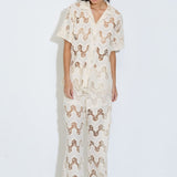 Model wearing the Cora ivory lace wide-leg pants with elasticated drawstring waist