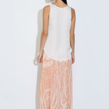Model wearing the Daniella maxi skirt in peach floral viscose satin with elasticated waist