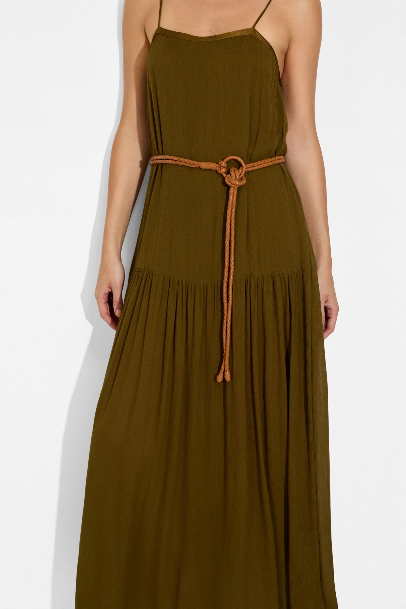 Maya Belt in Nugget braided leather tied at the waist of the olive Livia Maxi Dress