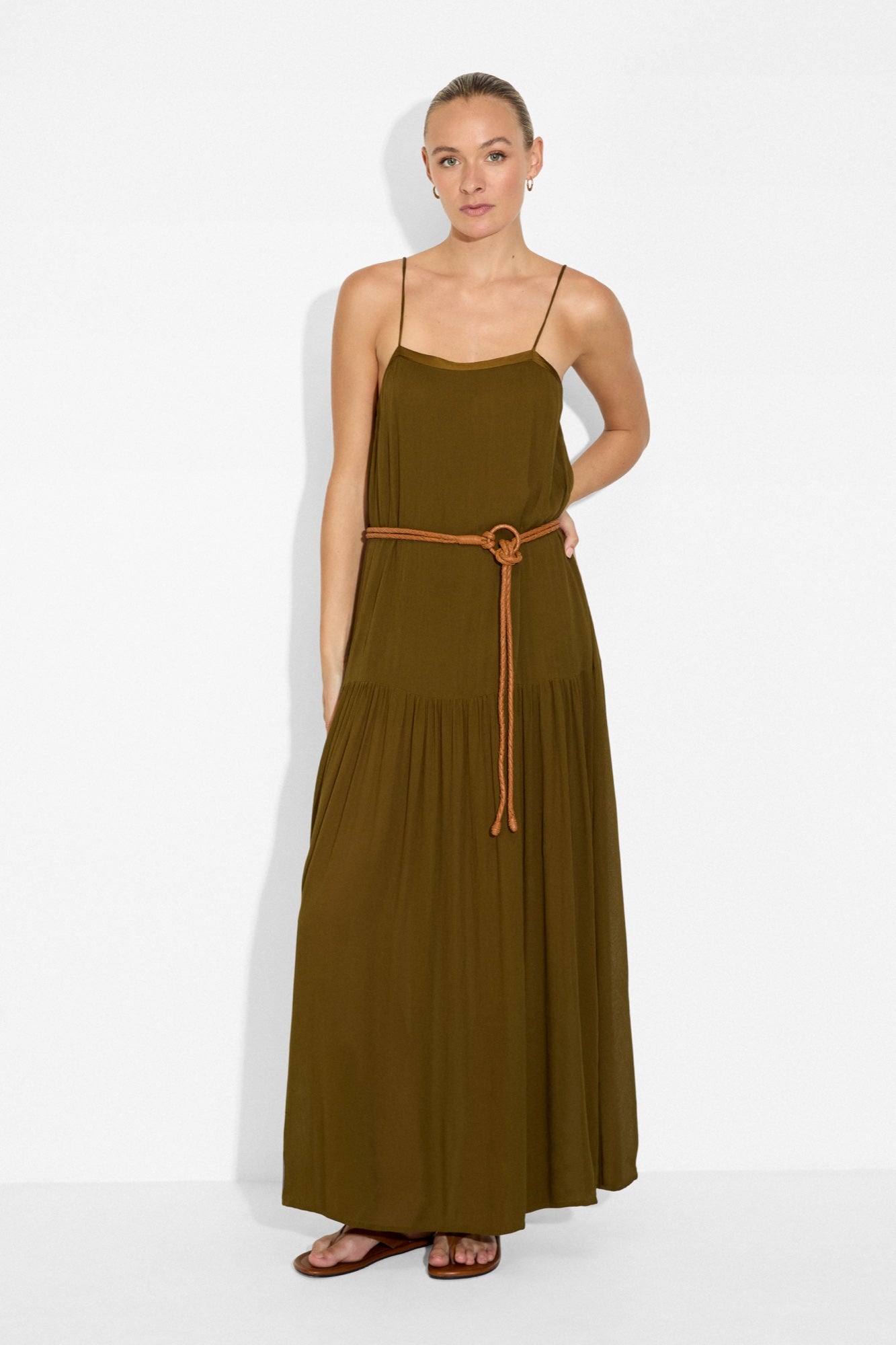 Model wearing the Maya Belt in Nugget over the olive Livia Maxi Dress
