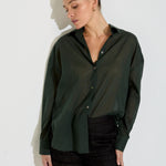 Model wearing the Nayara shirt in forest green cotton voile