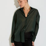 Model wearing the Nayara shirt in forest green cotton voile