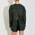 Model wearing the Nayara shirt in forest green cotton voile